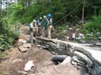 VYCC crew, leader & Greg Western on partially completed retaining wall