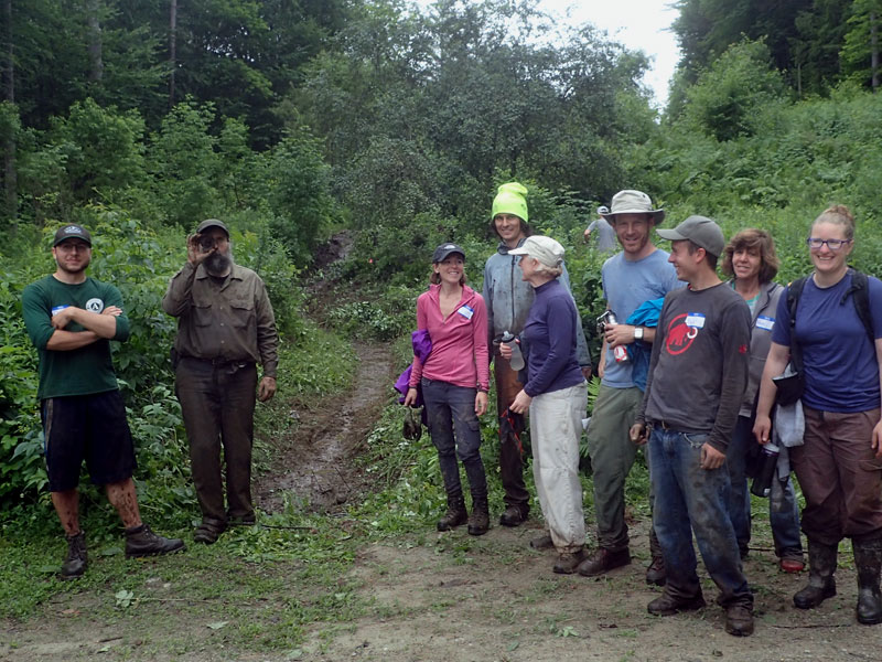 people in front of trail ditch