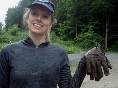 woman with muddy gloves