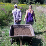 couple pulls wheelbarrow