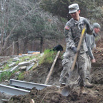 uniformed cadet shovels