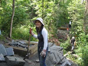 volunteers build bridge abutments