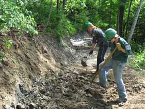 Youth Corps digging sidehill