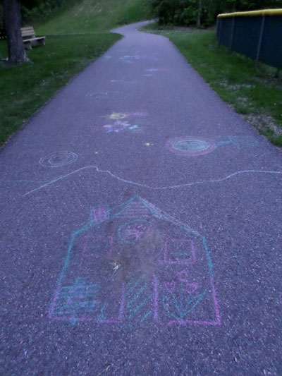 chalk drawing on paved path