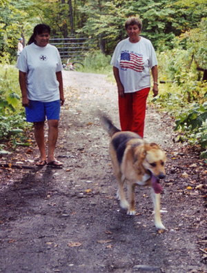 women walking dog