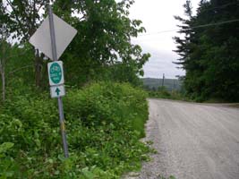 sign before intersection, left side